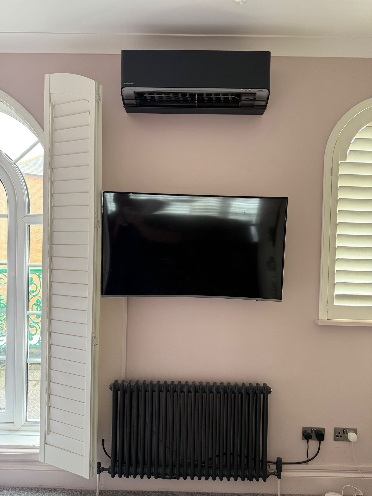 Air source heat pump indoor unit installed in a Sussex living room