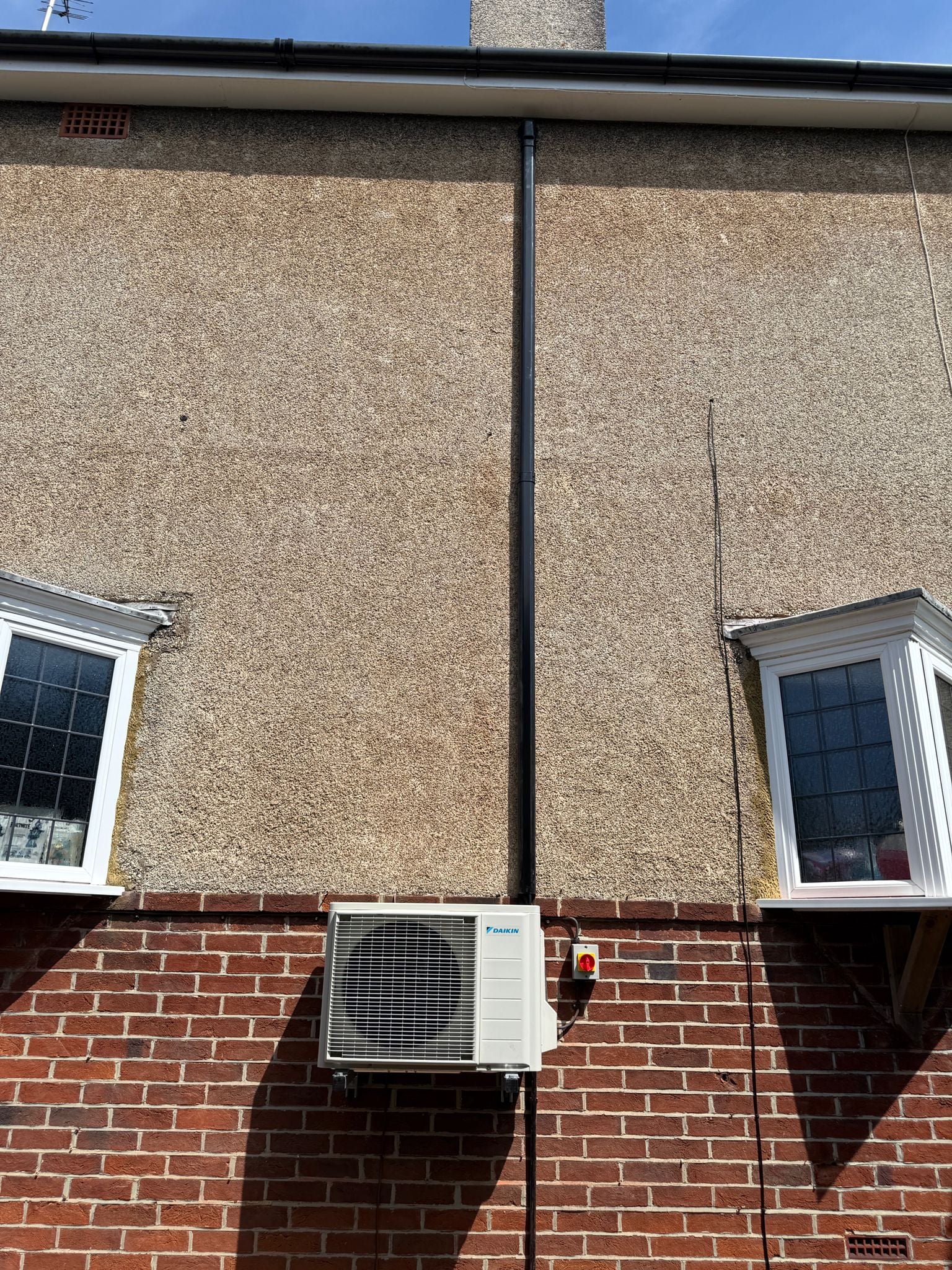 Air source heat pump outdoor unit fitted to a Sussex home