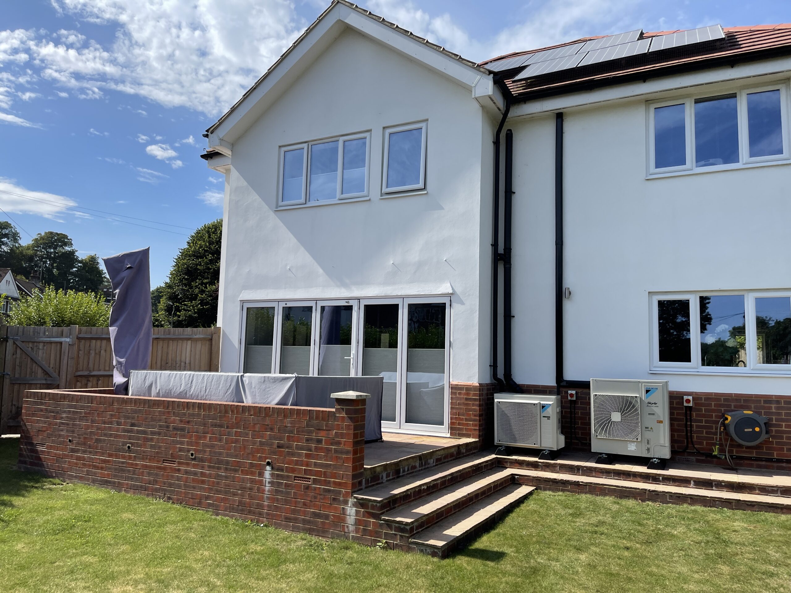 exterior of house with air conditioning unit in the back garden
