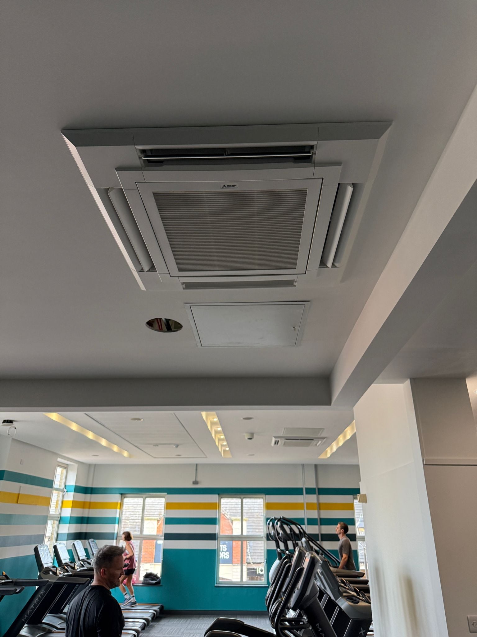 Mitsubishi ceiling cassette air conditioning unit in a commercial gym