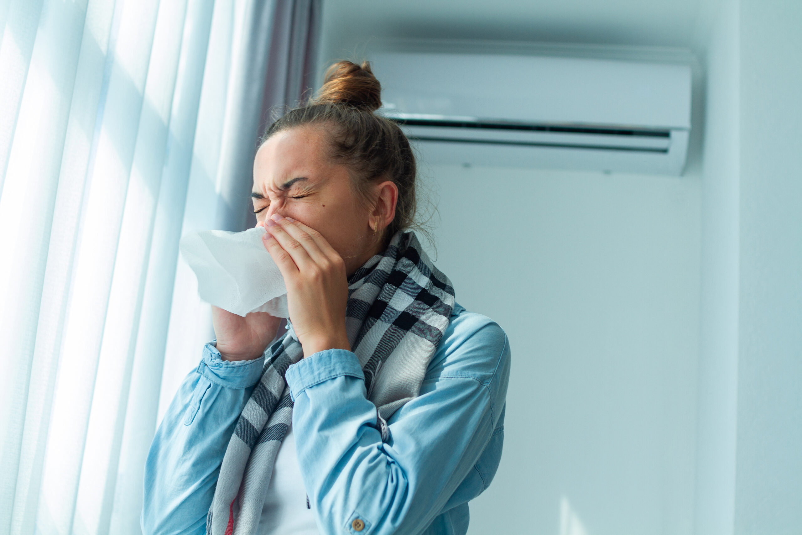 Is air conditioning bad for you? Dusty aircon causing woman to sneeze 