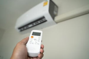 Air conditioning thermostat set to the wrong setting and blowing warm air